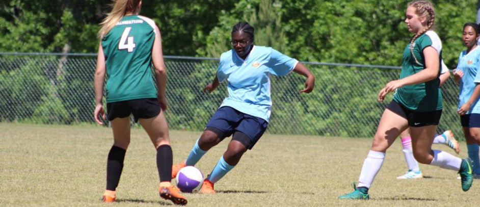 Kaylan Rhodes giving a through ball to the forwards.